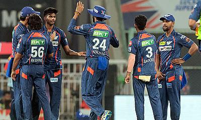 Lucknow Super Giants' Mayank Yadav celebrates with teammates