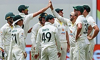 Australia's Nathan Lyon (3rd R) celebrates after taking the wicket of West Indies' Kraigg Brathwaite
