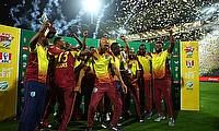 West Indies' Rovman Powell lifts the trophy with teammates after winning the series
