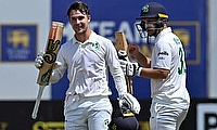Ireland's Curtis Campher celebrates with Andrew McBrine (R) after scoring a century