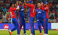 Delhi Capitals' Khaleel Ahmed celebrates the dismissal of Gujarat Titans' Wriddhiman Saha