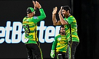 Salman Irshad (R) of Jamaica Tallawahs celebrates the dismissal of Andre Fletcher of Saint Kitts and Nevis Patriots