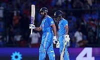 India's Rohit Sharma celebrates with Ishan Kishan after reaching his half century