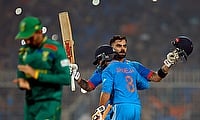 India's Virat Kohli celebrates with Ravindra Jadeja after reaching his 49th century, equalizing with Sachin Tendulkar's record of most number of ODI
