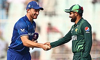 England's Jos Buttler and Pakistan's Babar Azam shake hands before the match