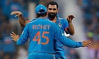 India's Mohammed Shami celebrates with Rohit Sharma