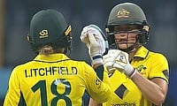 Phoebe Litchfield and Ellyse Perry fist bump