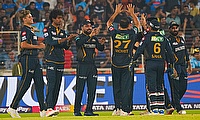 Gujarat Titans players celebrate the wicket of Mumbai Indians' Ishan Kishan during the IPL 2024