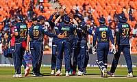 Gujarat Titans' Azmatullah Omarzai celebrates the wicket of Sunrisers Hyderabad's Mayank Agarwal with teammates