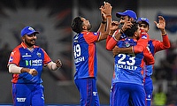 Delhi Capitals players celebrate the dismissal of Lucknow Super Giants' Nicholas Pooran