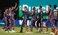 Kolkata Knight Riders' Mitchell Starc celebrates the dismissal of Delhi Capitals' David Warner