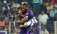 Kolkata Knight Riders' Andre Russell celebrates after taking the wicket of Sunrisers Hyderabad's captain Pat Cummins during the IPL