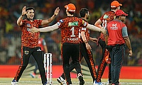 Sunrisers Hyderabad's Abhishek Sharma celebrates with teammates after taking the wicket of Rajasthan Royals' captain Sanju Samson