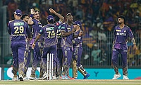 Kolkata Knight Riders' Mitchell Starc celebrates with teammates