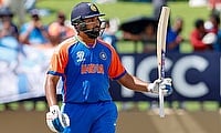 India's captain Rohit Sharma celebrates his half-century