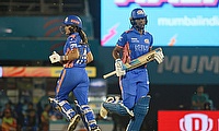 Mumbai Indians' Amelia Kerr and Hayley Matthews run between the wickets
