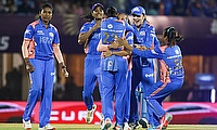 Mumbai Indians' Shabnim Ismail celebrates with teammates after dismissing Delhi Capitals' Shafali Verma