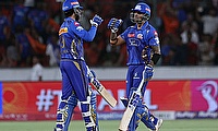 Mumbai Indians' Suryakumar Yadav and Tilak Varma celebrate after the match