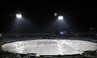 General view of covers on the field during a rain delay