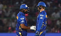 Mumbai Indians' Rohit Sharma and Ryan Rickelton bump fist