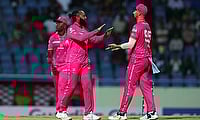 Jomel Warrican of Barbados Royals celebrates with teammate Daniel Sams