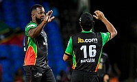 Kyle Mayers (L) of Saint Kitts and Nevis Patriots celebrates