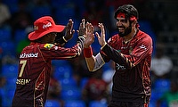 Usman Tariq (R) of Trinbago Knight Riders celebrates