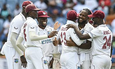 West Indies players celebrate a wicket