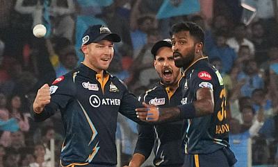 GT captain Hardik Pandya with David Miller and Abhinav Manohar celebrate the dismissal of MI captain Rohit sharma alt=