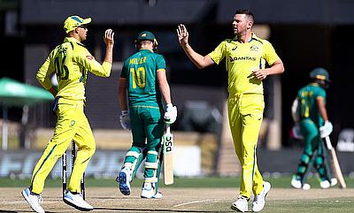 Australia's Josh Hazlewood celebrates with Ashton Agar after taking the wicket of South Africa's David Miller alt=