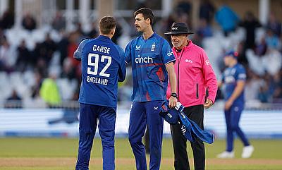 England's George Scrimshaw and Brydon Carse celebrate taking the wicket of Ireland's Josh Little to win the match alt=