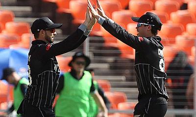 New Zealand's Devon Conway celebrates with Mark Chapman after taking a catch to dismiss England's Harry Brook alt=