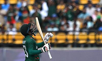 Bangladesh's Mehidy Hasan Miraz celebrates after reaching fifty against Afghanistan