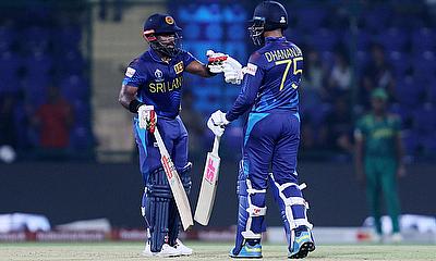 Sri Lanka's Charith Asalanka and Dhananjaya de Silva bump fists during their innings alt=