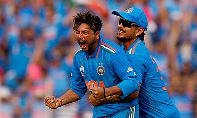India's Kuldeep Yadav celebrates with Ishan Kishan after taking the lbw wicket of Pakistan's Saud Shakeel alt=