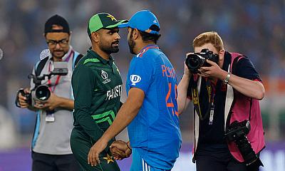 Pakistan's Babar Azam shakes hands with India's Rohit Sharma after the match alt=