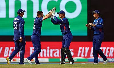 England's Mark Wood celebrates after taking the wicket of Afghanistan's Mohammad Nabi, caught by Joe Root alt=