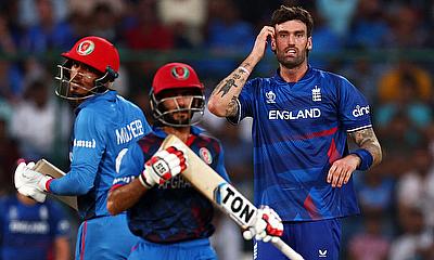 Afghanistan's Ikram Alikhil and Mujeeb-ur-Rahman in action running between the wickets as England's Reece Topley looks on alt=