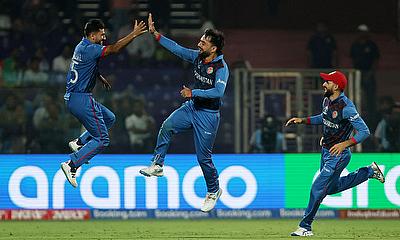 Afghanistan's Rashid Khan celebrates after taking the lbw wicket of England's Liam Livingstone