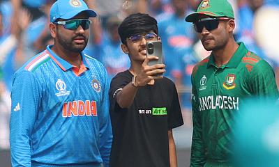 A Fan takes a selfie with India's captain Rohit Sharma and Bangladesh's captain Najmul Hossain Shanto at the toss alt=