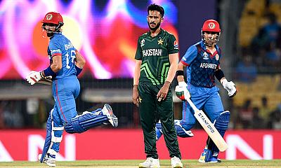 Pakistan's Hasan Ali looks on after bowling as Afghanistan's Ibrahim Zadran and Rahmanullah Gurbaz run between the wickets alt=