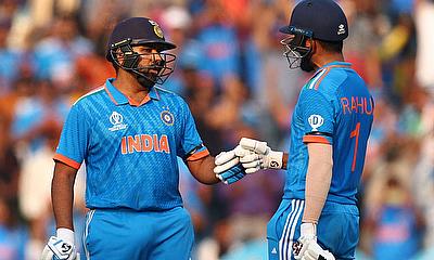 India's Rohit Sharma celebrates with KL Rahul after reaching his half century alt=