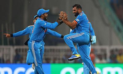 India's Mohammed Shami celebrates with Suryakumar Yadav after taking the wicket of England's Jonny Bairstow alt=