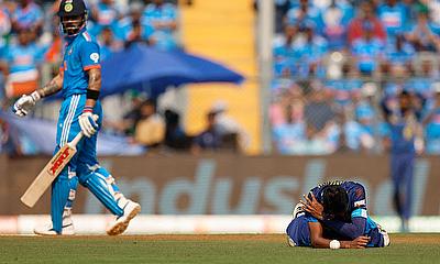 Sri Lanka's Dushmantha Chameera reacts in pain after he drops a catch to dismiss India's Virat Kohli alt=