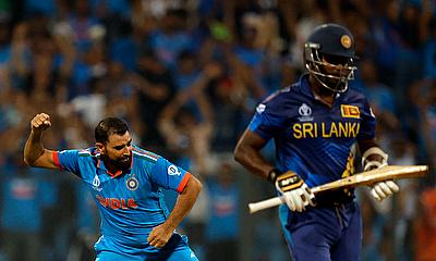 India's Mohammed Shami celebrates after taking the wicket of Sri Lanka's Angelo Mathews alt=
