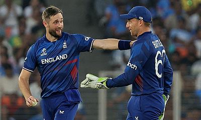 England's Chris Woakes celebrates after taking the wicket of Australia's Adam Zampa, caught by Jos Buttler alt=