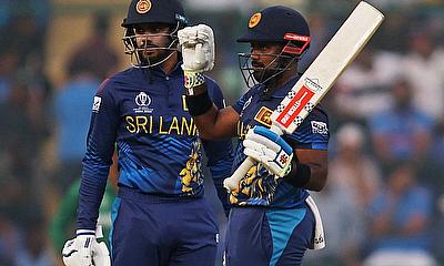 Sri Lanka's Charith Asalanka celebrates after reaching his half century alt=