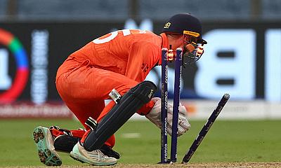 Netherlands' Scott Edwards in action as he takes the wicket of England's Dawid Malan alt=