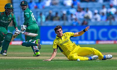 Australia's Sean Abbott fields a ball as Bangladesh's Tanzid Hasan Tamim and Litton Das run between the wickets alt=