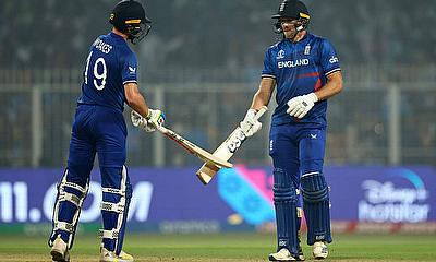 England's David Willey celebrates hitting a four with Chris Woakes alt=